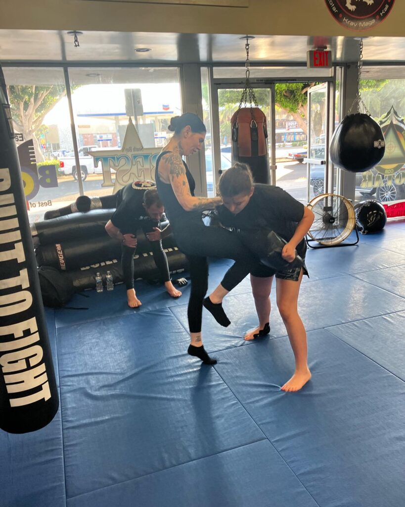 women kickboxing in mma gym