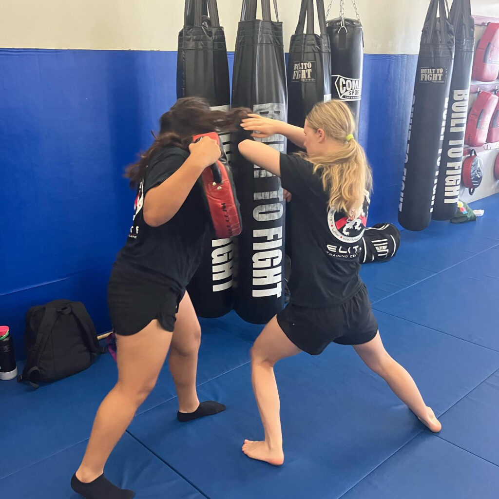 young women fighting in group class training session