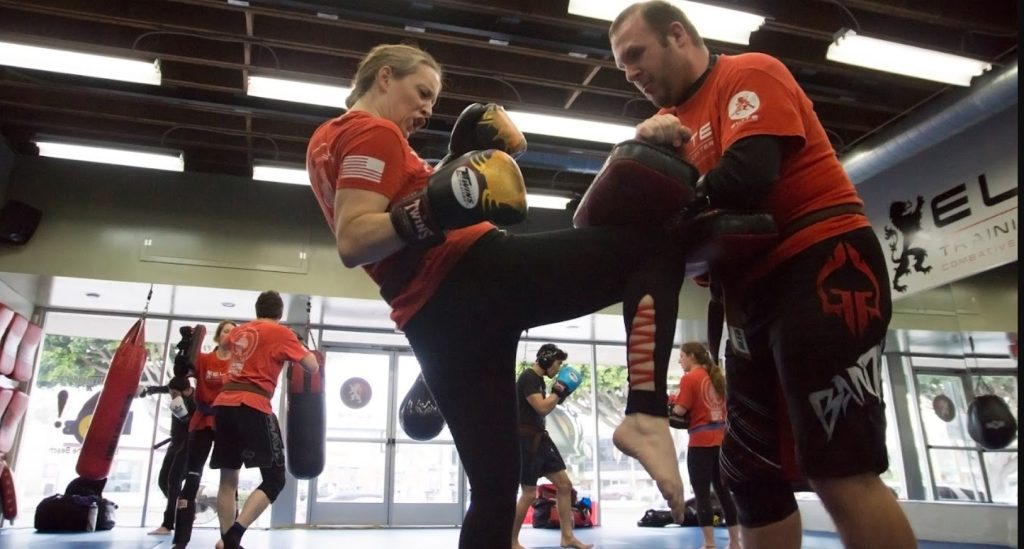 MMA Gym Redondo Beach Woman kicking instructor