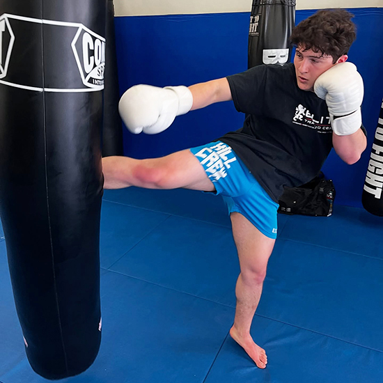 kickboxing training technique with heavy bag