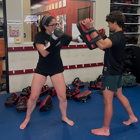 kickboxing classes with a boy and a girl training